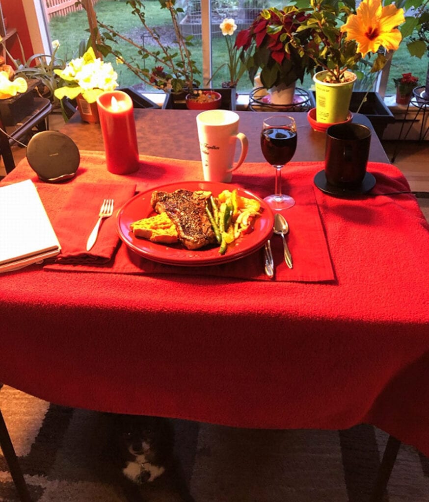 food on a red plate on a table with red cloth